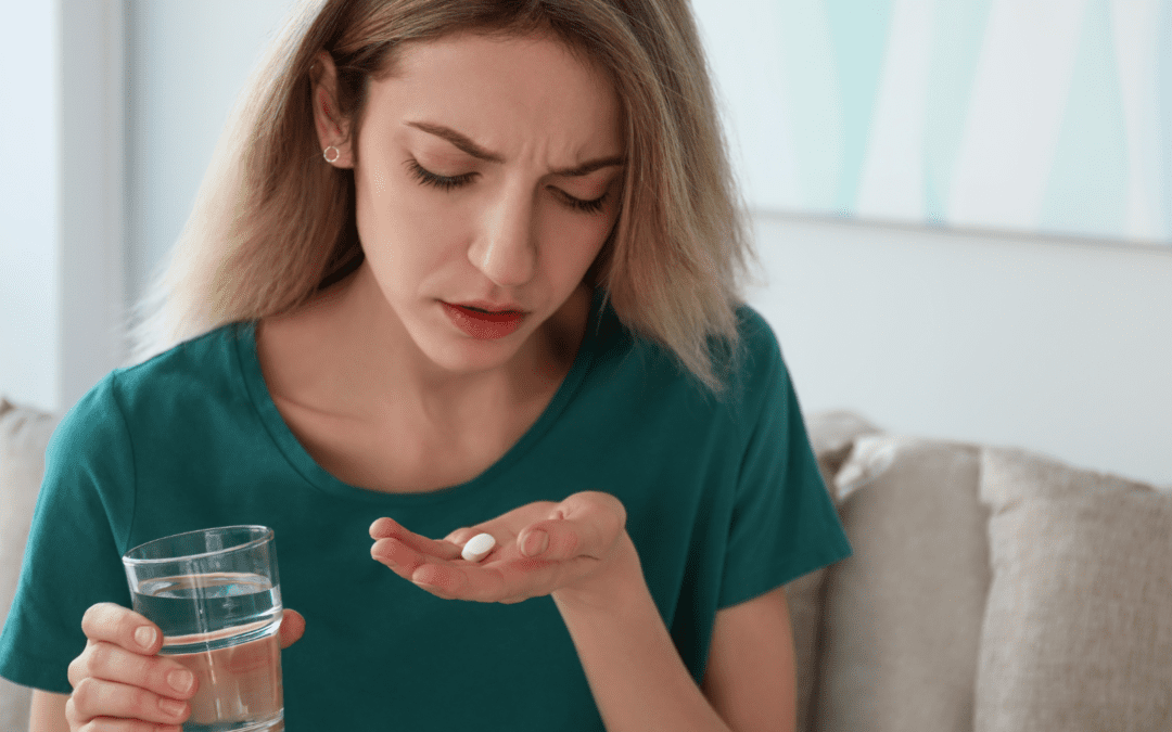 woman holding the abortion pill