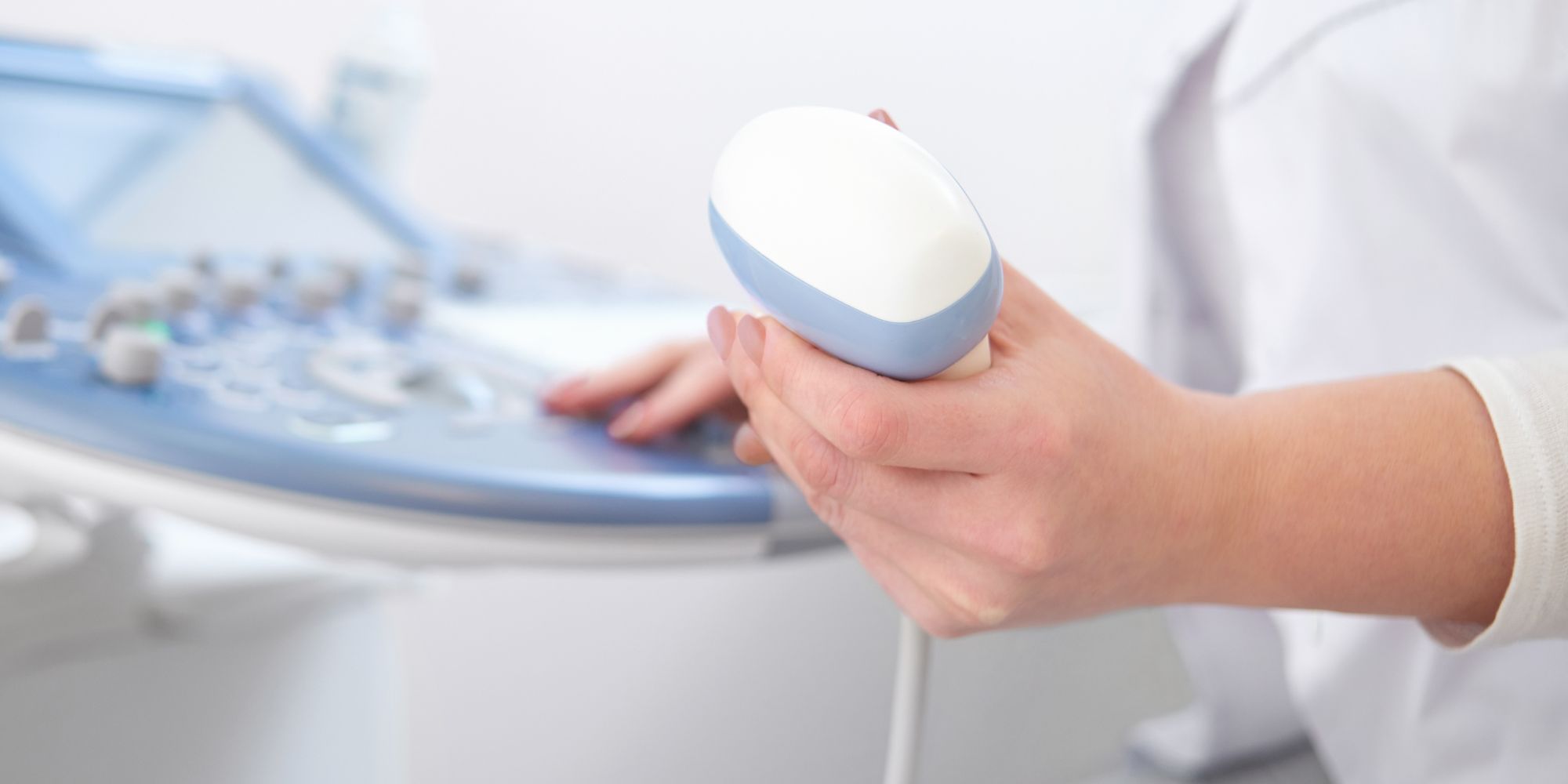 Nurse performing an transabdominal ultrasound