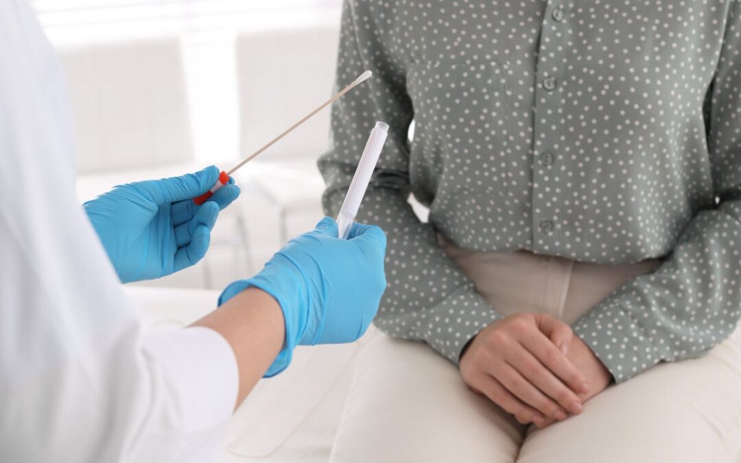 doctor taking std test from woman